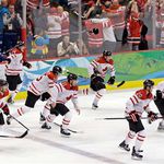 Team Canada reacts after the gold medal-winning goal